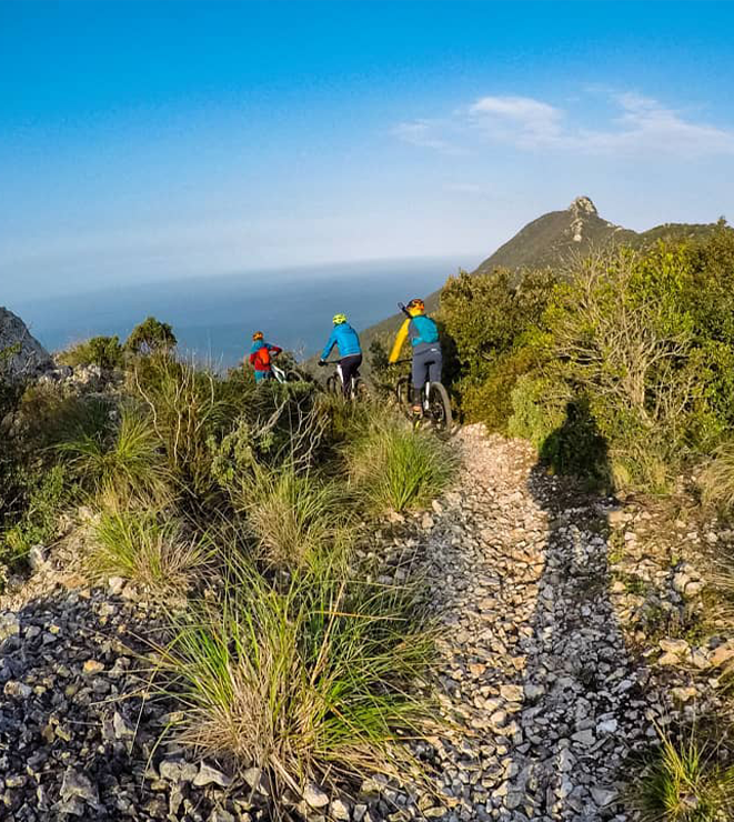biker walks a small path