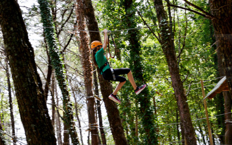child sliding suspended on a rope