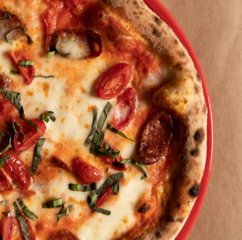 porzione appetitosa di pizza del Le Palme Village